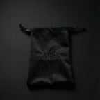 Ludo Ghar velvet pouch holding premium Ludo board game pieces